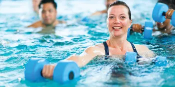 Woman in water exercise class