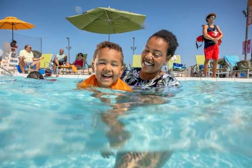 Mom and child in outdoor pool