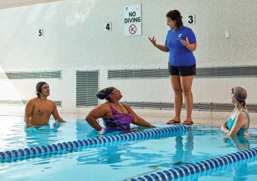 adults in a swim lesson
