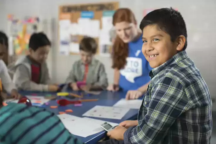 Boy finishing homework in after school program