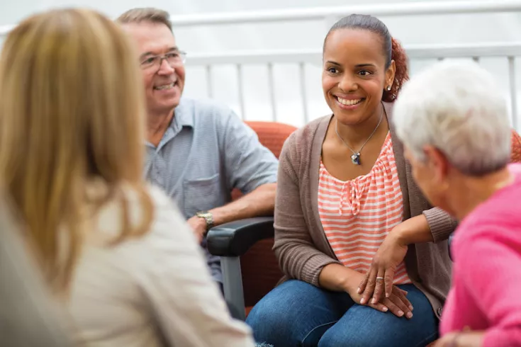 Group of adults smiling warmly