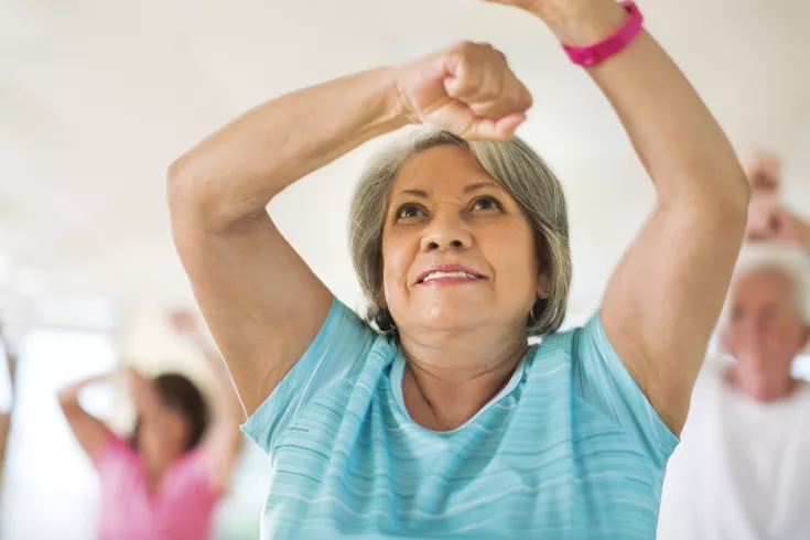 Older woman doing exercise movements