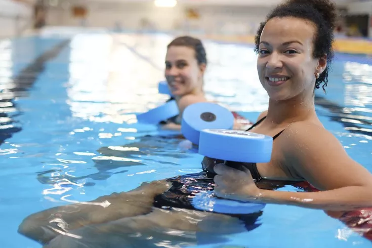 woman smiling in water exercise class