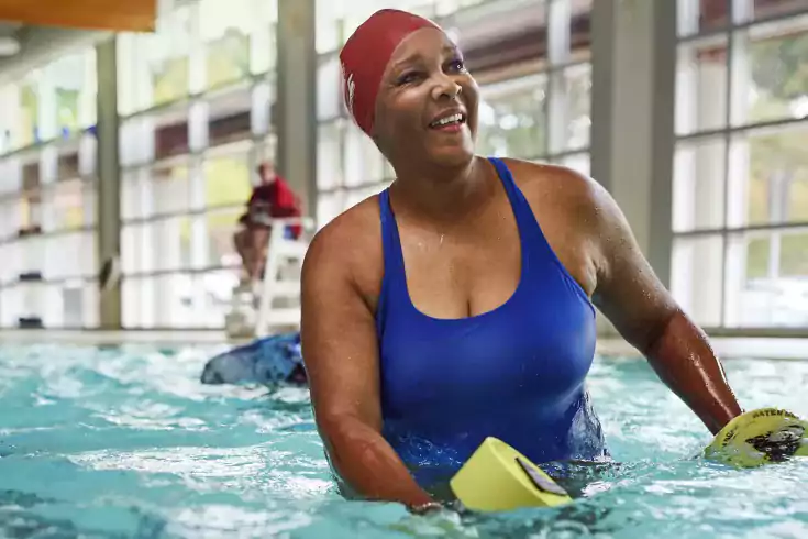 Woman in water exercise class