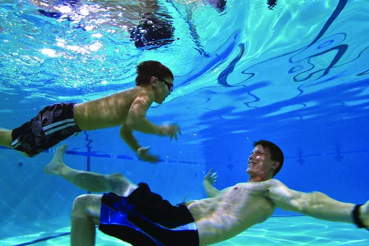 Father and son swimming