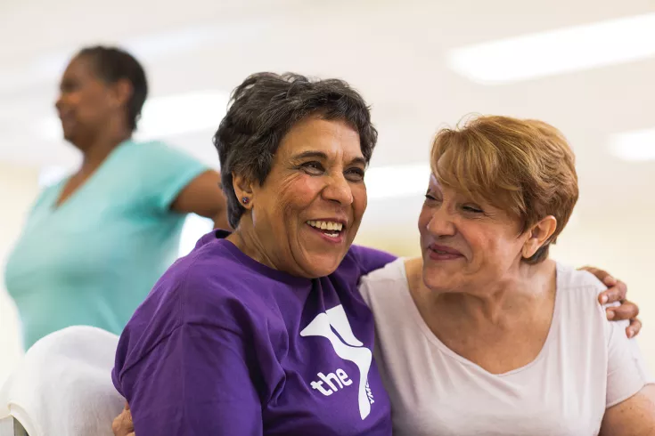Two senior women laughing