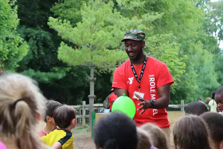 Y Camp counselor with kids