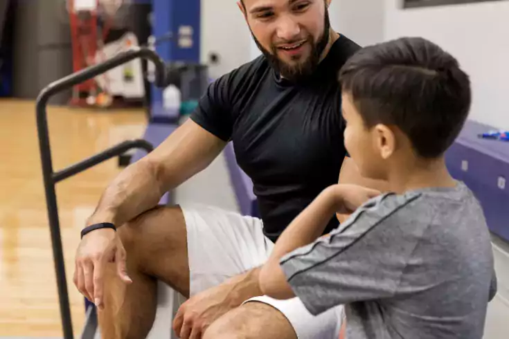 A mentor talking to his mentee