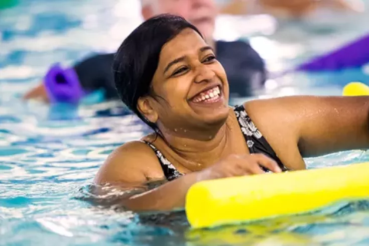 Woman in water exercise class