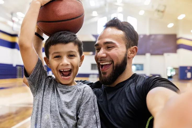 Father and son with basketball