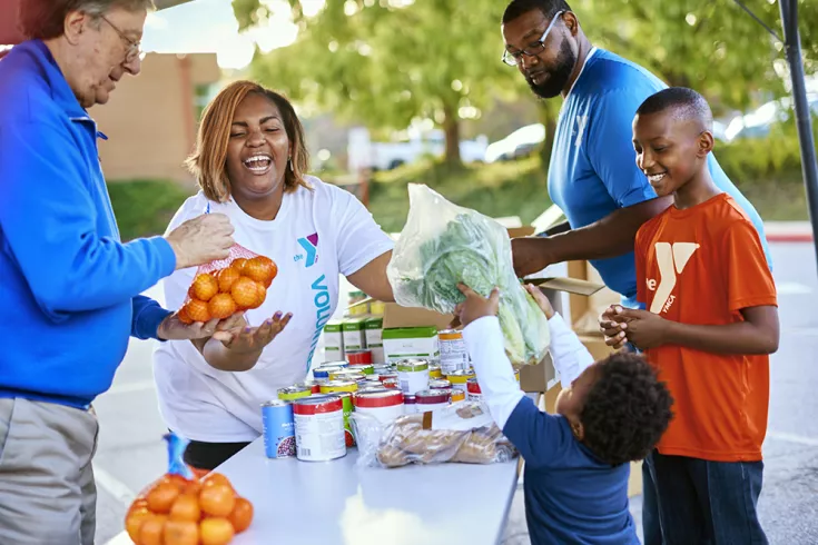 A volunteer helping with food distribution