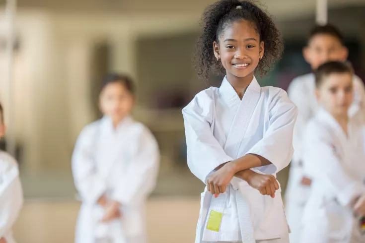 Young girl in a martial arts class