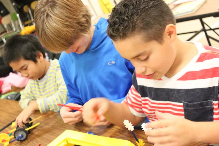 Boys creating a race car