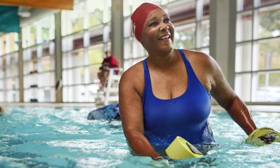 Woman in water exercise class