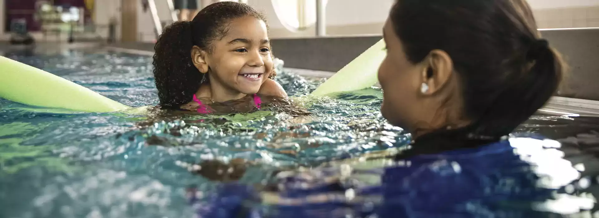 Girl learning to swim