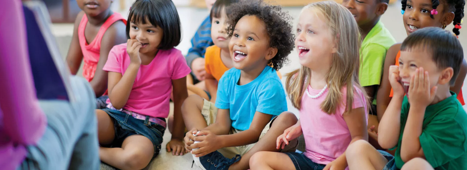 Preschool kids enjoying story time