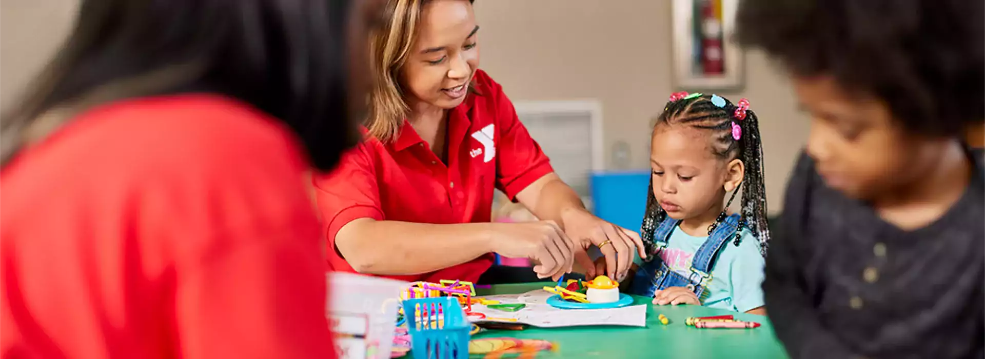 Y preschool teachers working with children