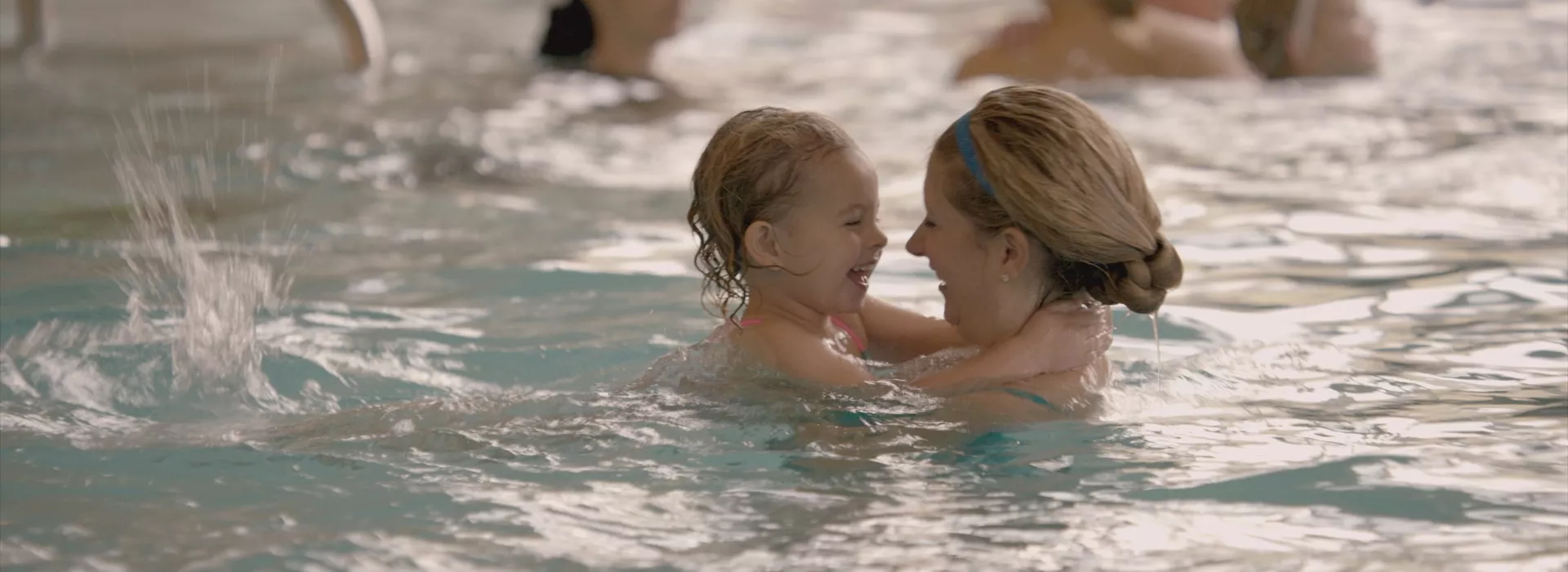 Mom and child in pool