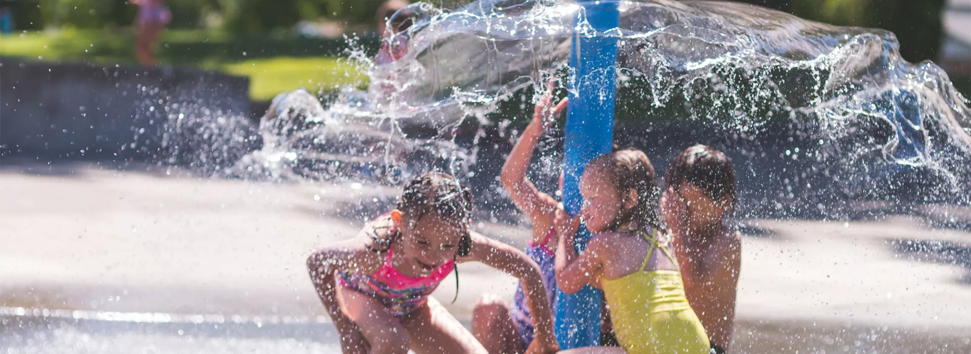 Kids playing at the splash pad