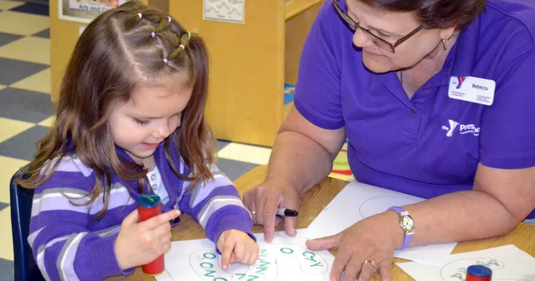 Young girl learning letters