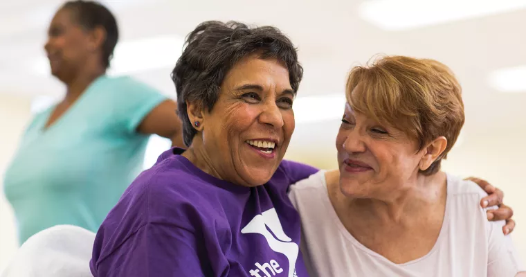 Two senior women laughing